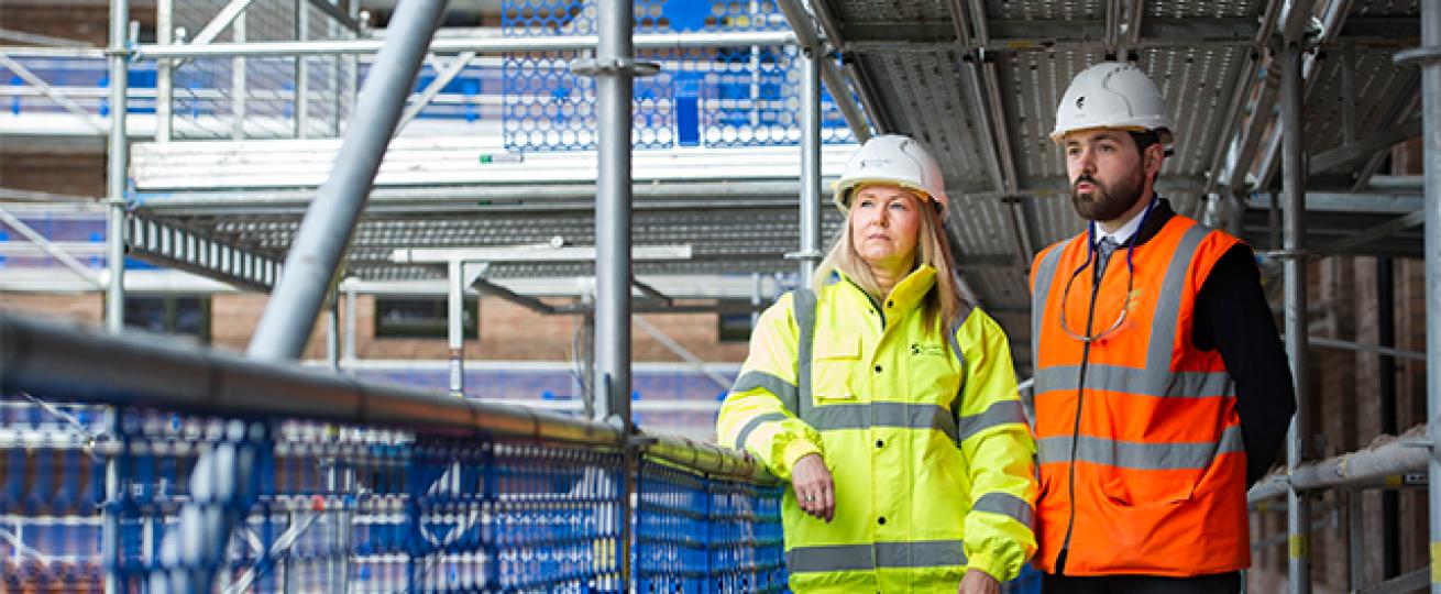 Sanctuary staff survey a building site Sanctuary staff survey a building site