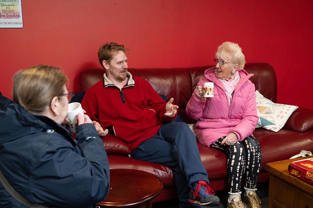 Sanctuary residents sat on a sofa while meeting their housing officers Sanctuary residents sat on a sofa while meeting their housing officers