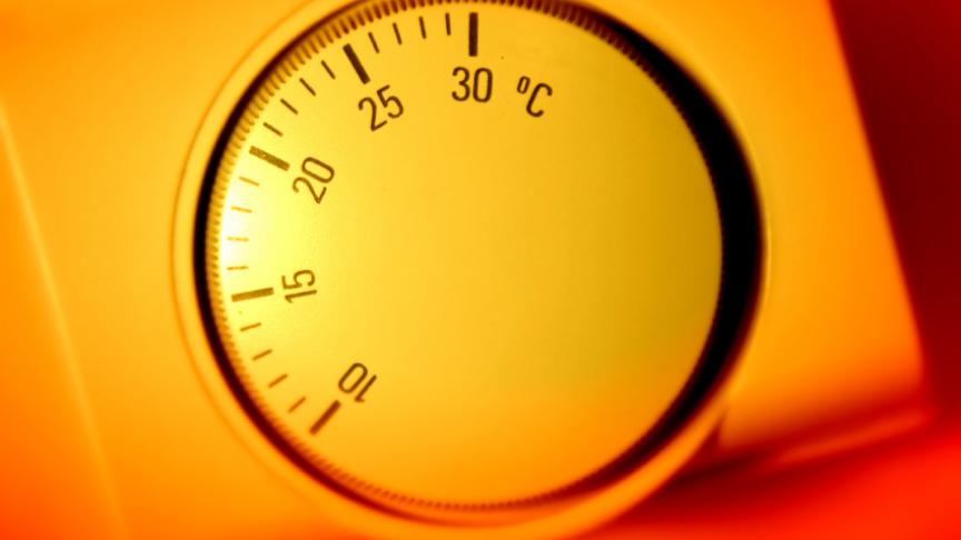 Thermostat A thermostat is shown surrounded by a warm orange glow