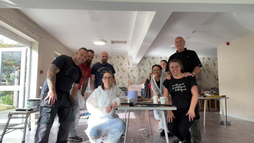 Lavers redecoration Sanctuary staff stand in a room that has recently been redecorated