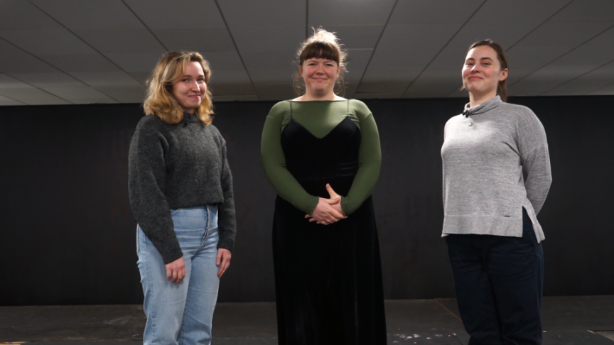 Butt Three women standing in a room smiling